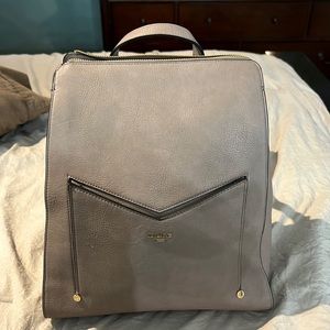 Dune London Color is between a Mauve and beige it's a Beautiful color like new